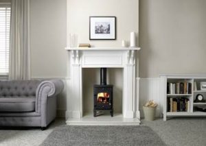 cast iron wood burning stove in a fireplace